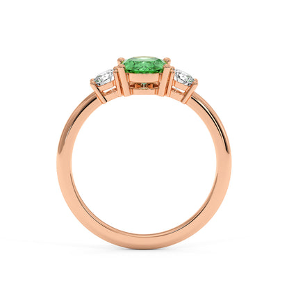 Rose gold 1.75CT green YAG ring with vibrant oval center gemstone and two round diamonds. Elegant, luxurious design, white background.