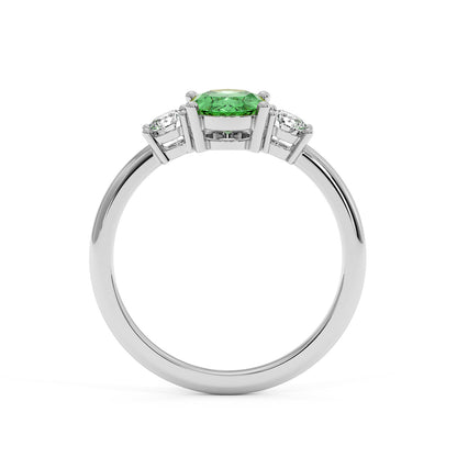 14k white gold 1.75CT Oval Green YAG ring with vivid green center gemstone and two smaller clear stones. Elegant design.