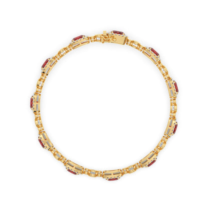 14k gold necklace: Ornate circular links featuring embedded red ruby and glittering accents.