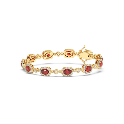 Elegant 14k gold bracelet with oval red gemstones encircled by small clear stones.