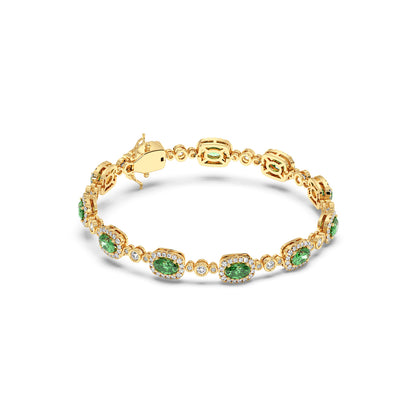 14k gold bracelet featuring oval emerald gemstones and small round diamonds, elegantly linked.
