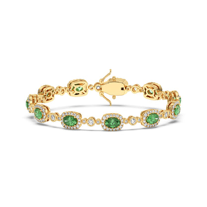 Elegant 14k gold bracelet with oval emerald gemstones surrounded by small white stones.