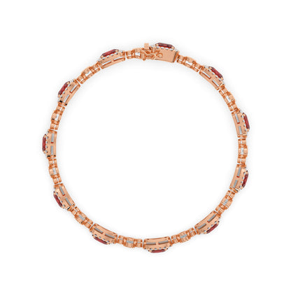 Elegant 14k rose gold bracelet with intricate links and ruby gemstone accents, evenly spaced around the band.