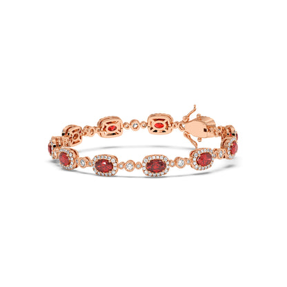 Elegant 14k rose gold bracelet with oval ruby gemstones encircled by small diamonds.