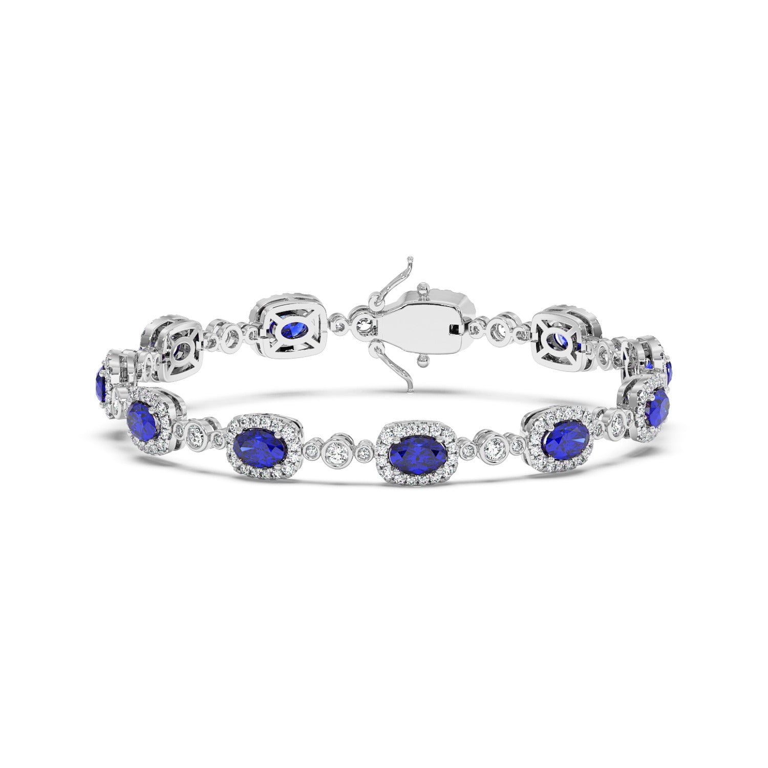 Elegant 14k white gold bracelet with oval blue sapphire gemstones framed by small white diamonds.