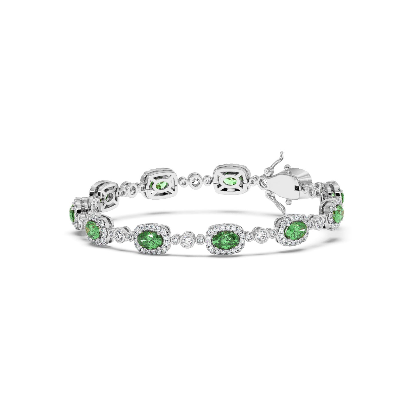 Elegant 14k white gold bracelet with oval emerald gemstones encircled by small white crystals, linked together.