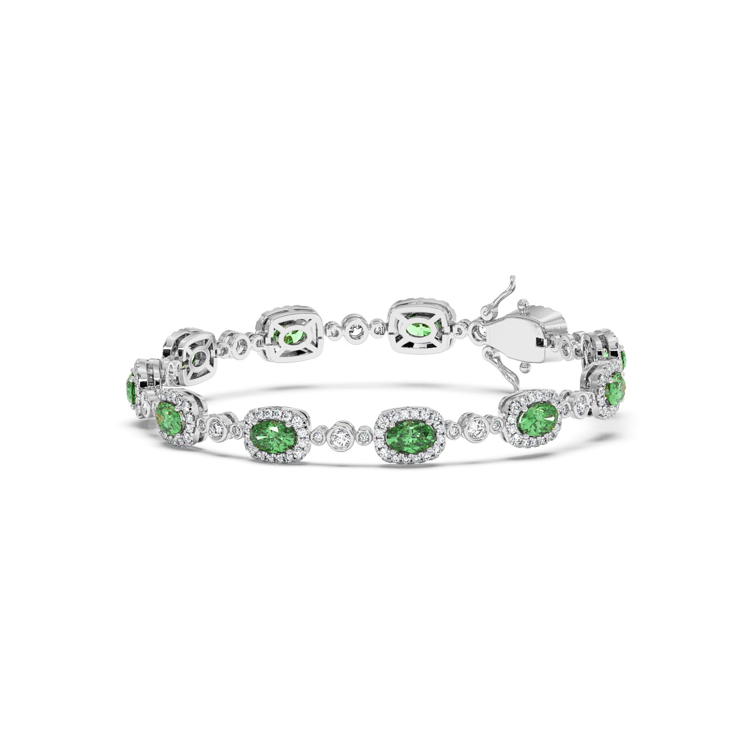 Elegant 14k white gold bracelet with oval emerald gemstones encircled by small white crystals, linked together.
