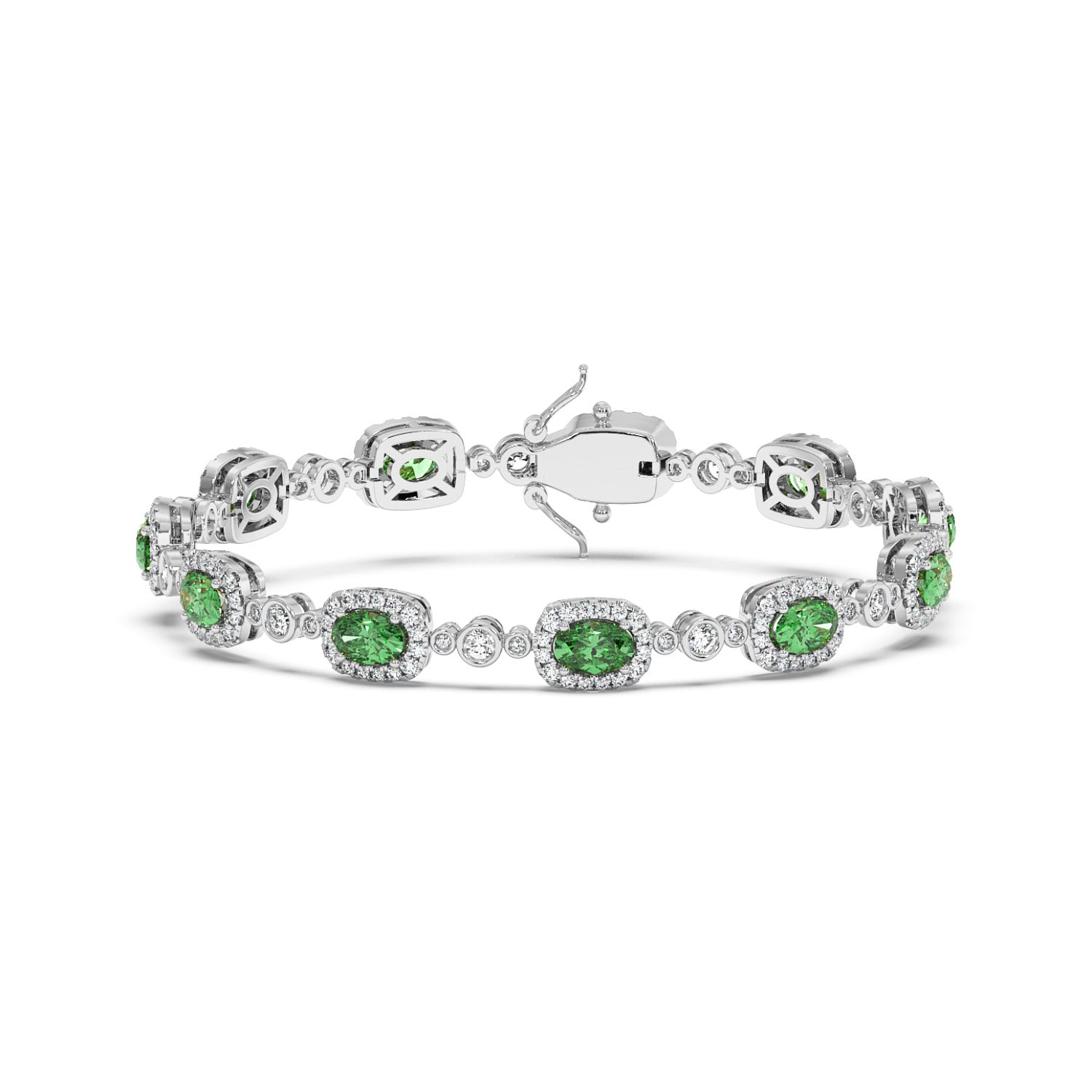 Elegant 14k white gold bracelet with sparkling oval emeralds surrounded by small clear stones.