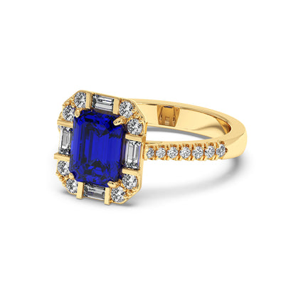 Gold ring with a large blue sapphire center, surrounded by smaller diamonds, showcasing an elegant and luxurious design.