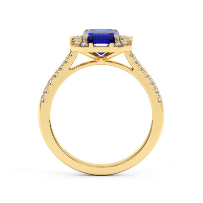 Gold ring with a deep blue rectangular sapphire center and a diamond-adorned band, creating an elegant and luxurious appearance.
