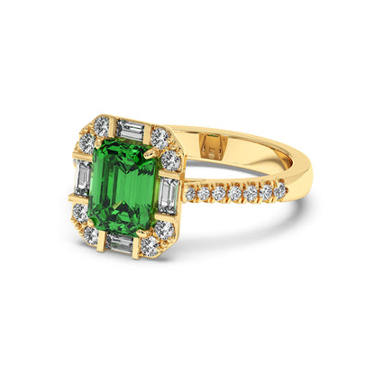 Gold ring with an emerald-cut green YAG surrounded by clear diamonds, band adorned with small diamonds, exuding elegance and luxury.