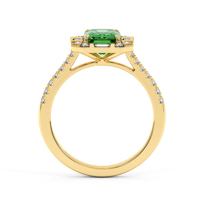 Gold ring with a vibrant green YAG center and small diamonds along the intricately detailed band, conveying elegance and luxury.