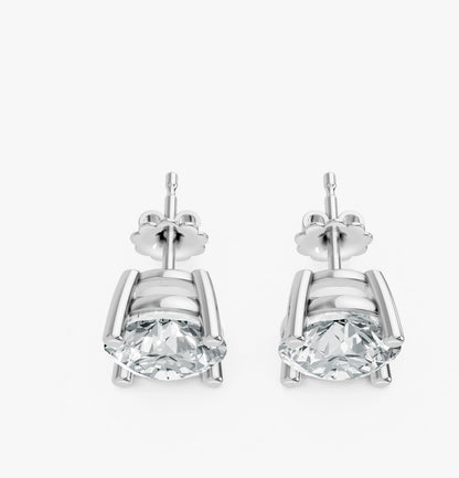 Two elegant stud earrings feature round diamonds set in 925 Silver prong settings.