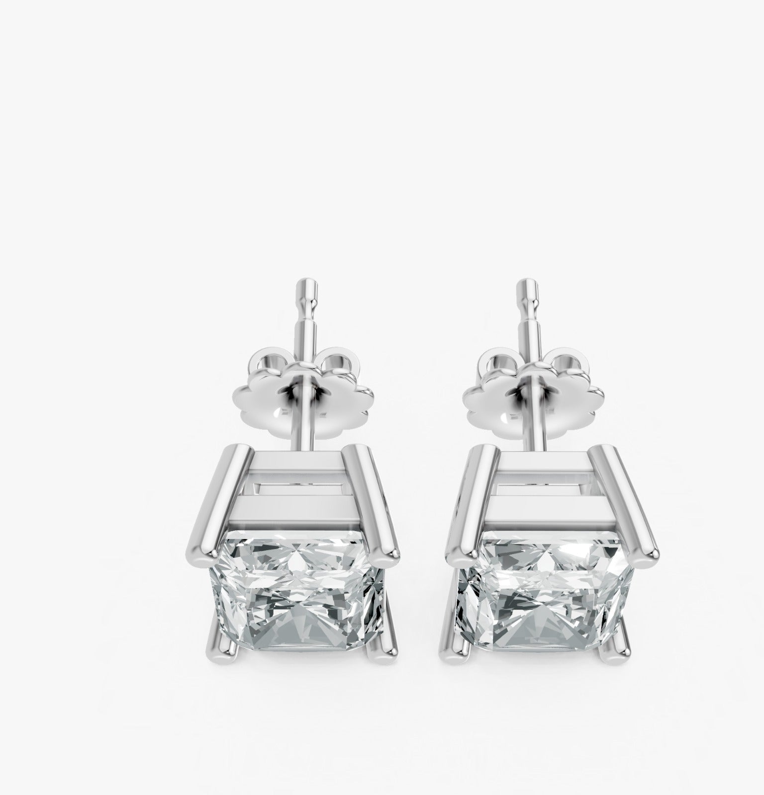 Two radiant cut lab-grown diamond stud earrings in white gold plated settings with butterfly clasps. Elegant and simple.