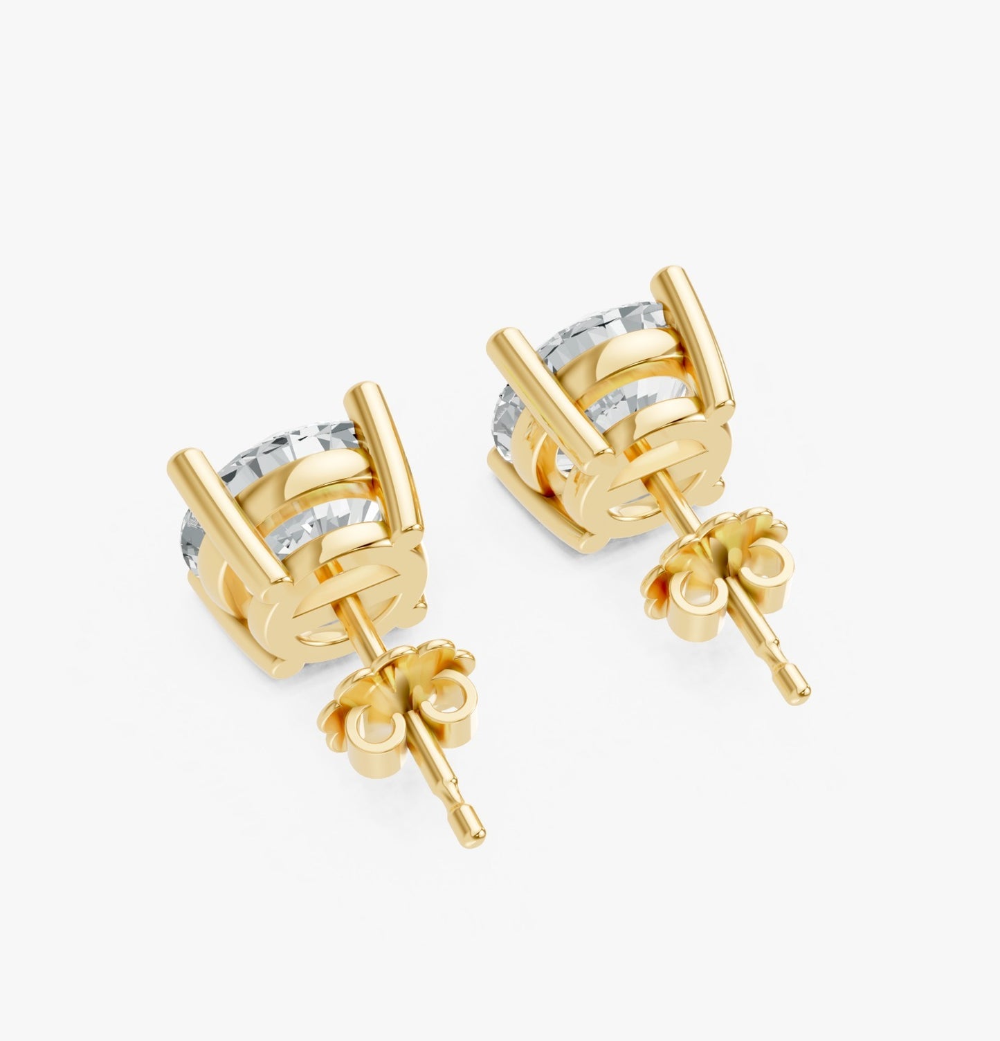 A pair of Gold plated stud earrings with sparkling circular diamonds are viewed from the back.
