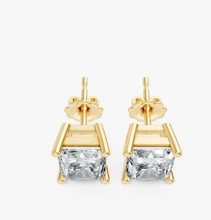 Two gold plated stud earrings with radiant cut lab-grown clear gemstones displayed on white. Elegant minimalist design exudes luxury.