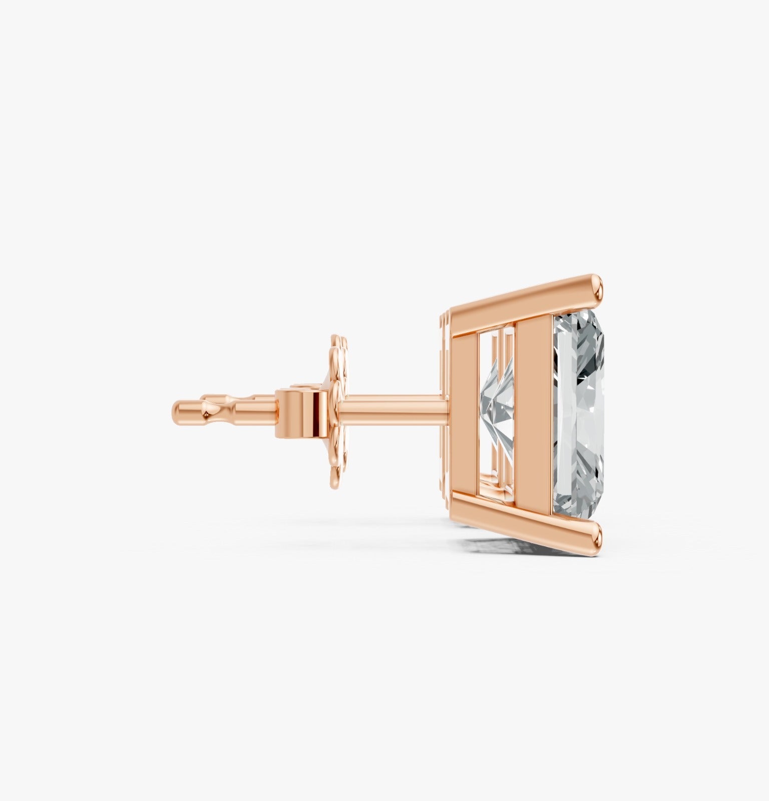 Rose gold plated stud earring with a large, rectangular, clear gemstone in a prong setting, side view. Elegant and luxurious.
