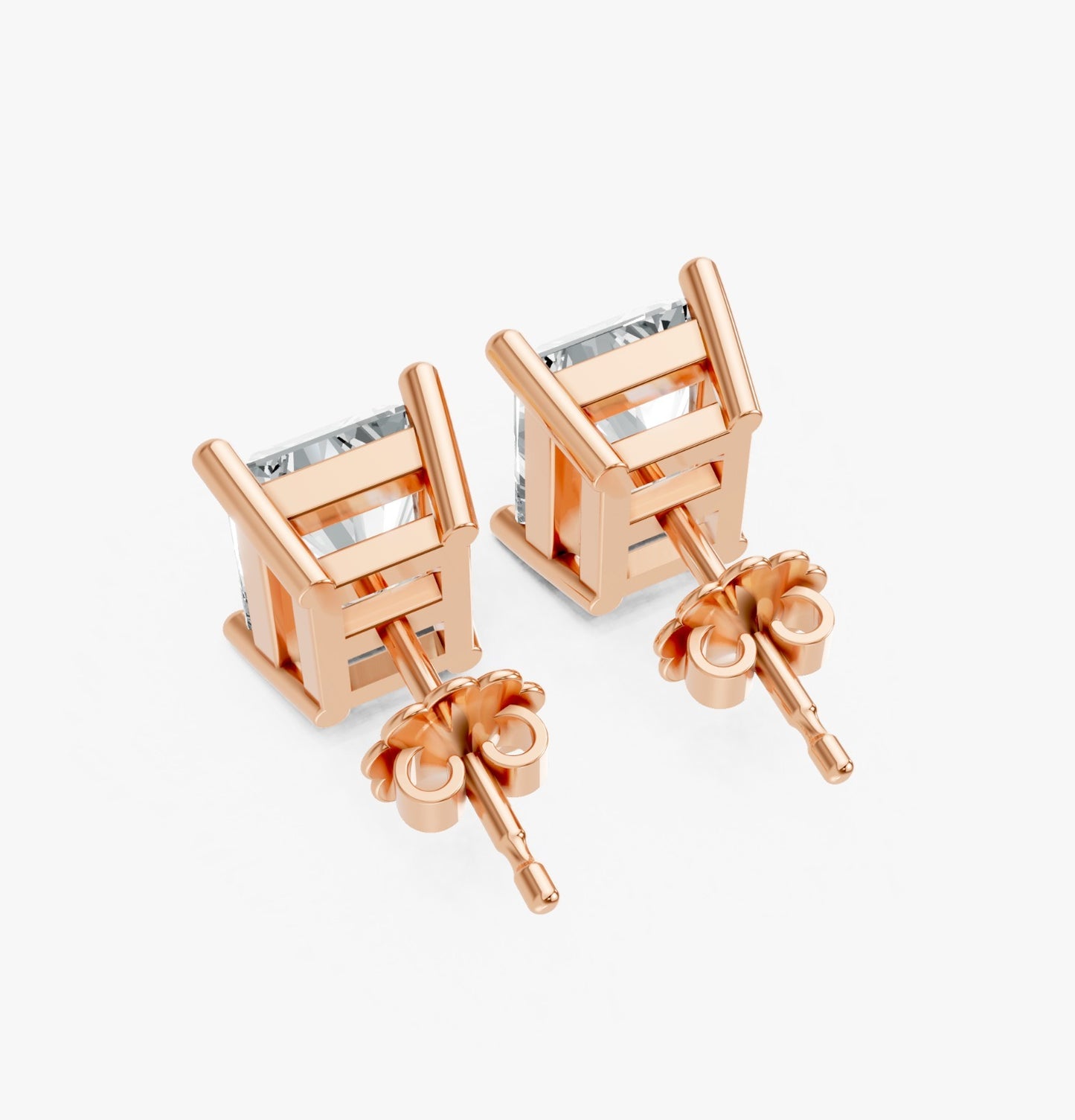 Two radiant-cut lab-grown diamond stud earrings set in rose gold plated metal, angled to show detailed backings. Elegant and modern.