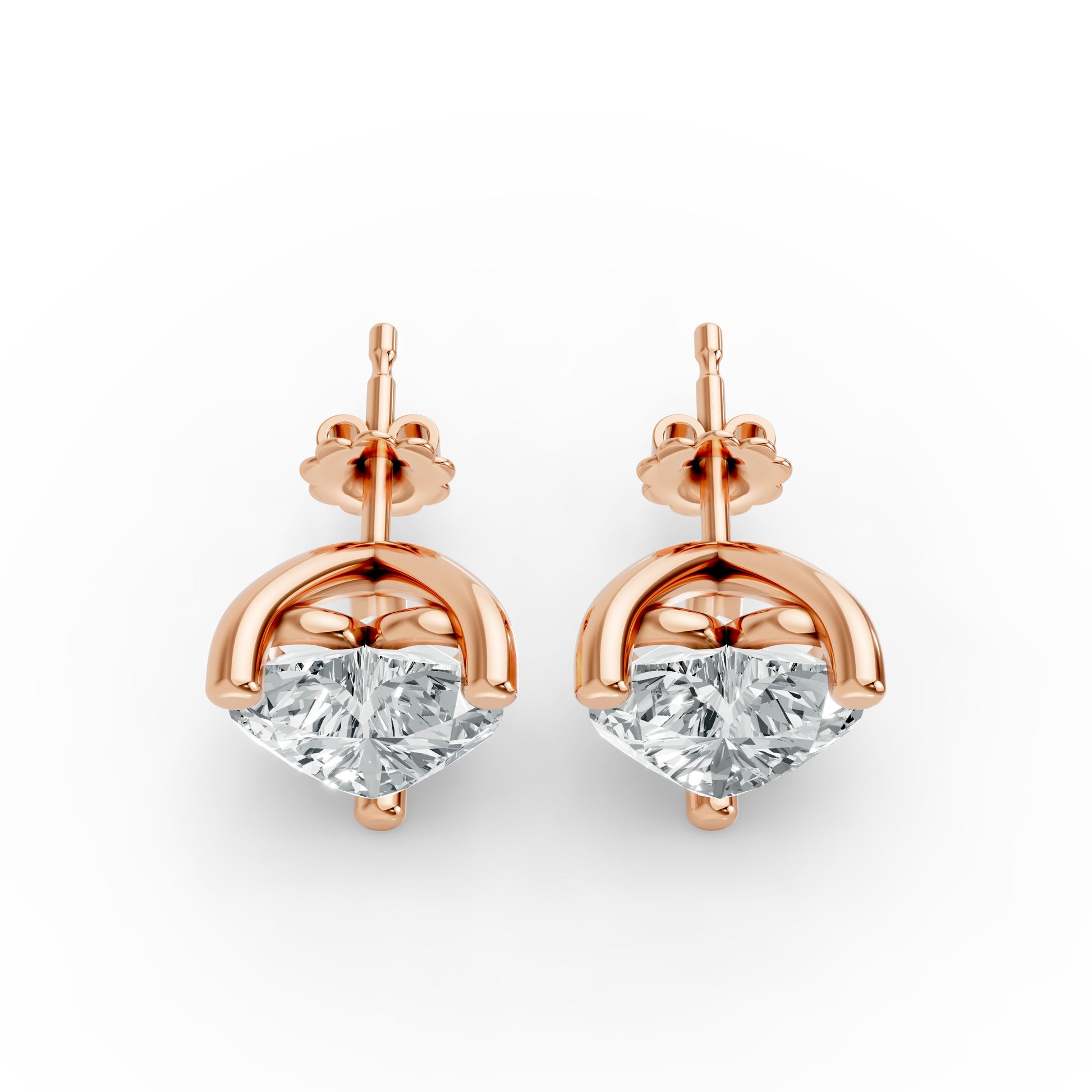 Pair of elegant rose gold plated stud earrings featuring sparkling diamonds. Luxurious and sophisticated design.