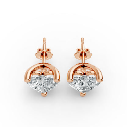 Pair of elegant rose gold plated stud earrings featuring sparkling diamonds. Luxurious and sophisticated design.