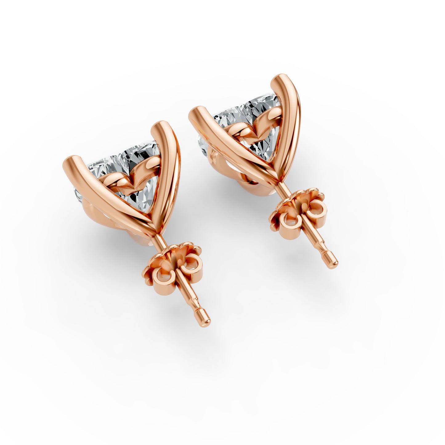 Pair of rose gold plated stud earrings, each with a heart-shaped setting holding sparkling diamonds. Elegant and luxurious.
