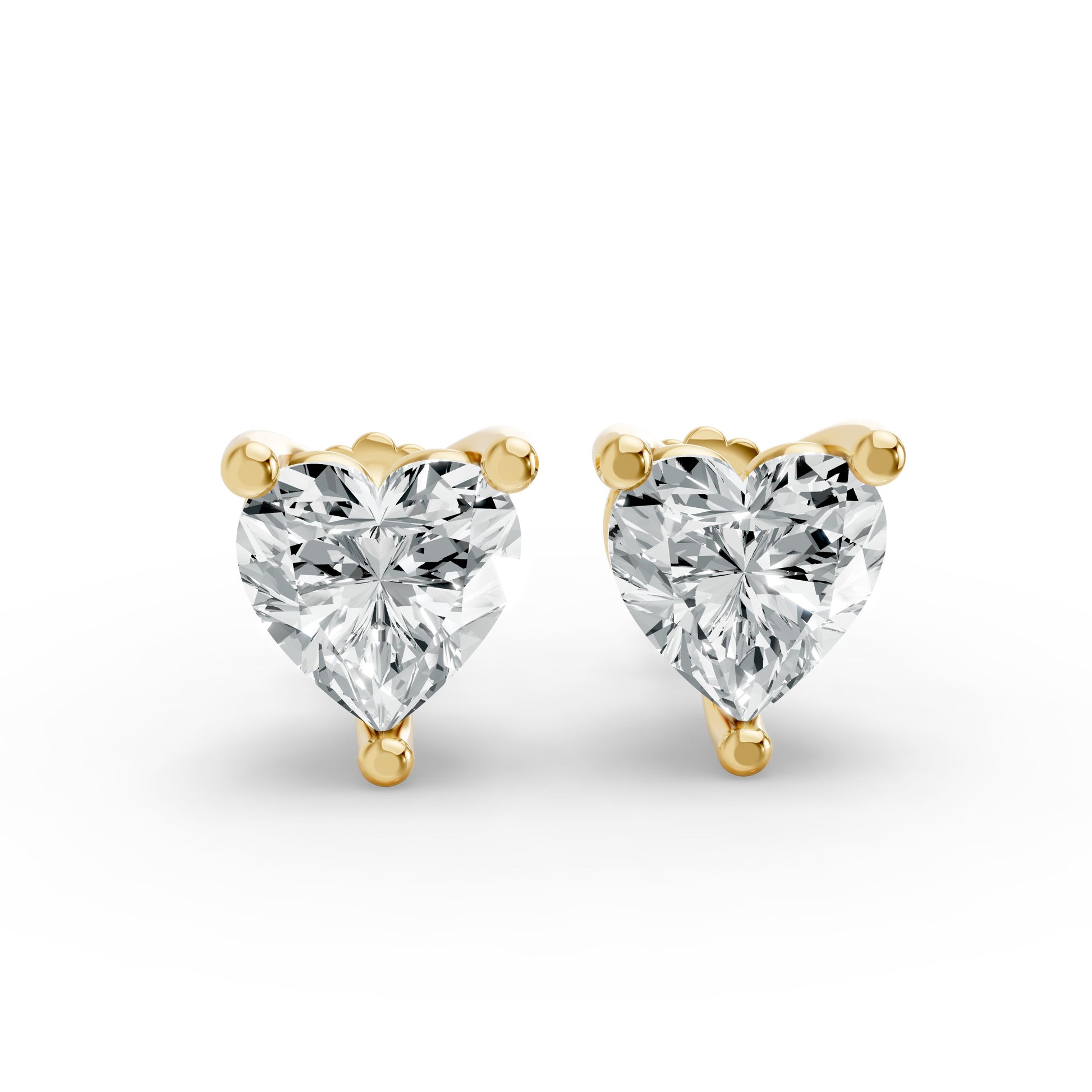 Gold plated heart-shaped diamond stud earrings. The sparkling diamonds exude elegance and romance against a white background.